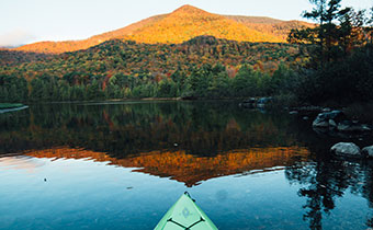 kayak in lake looking at mountains