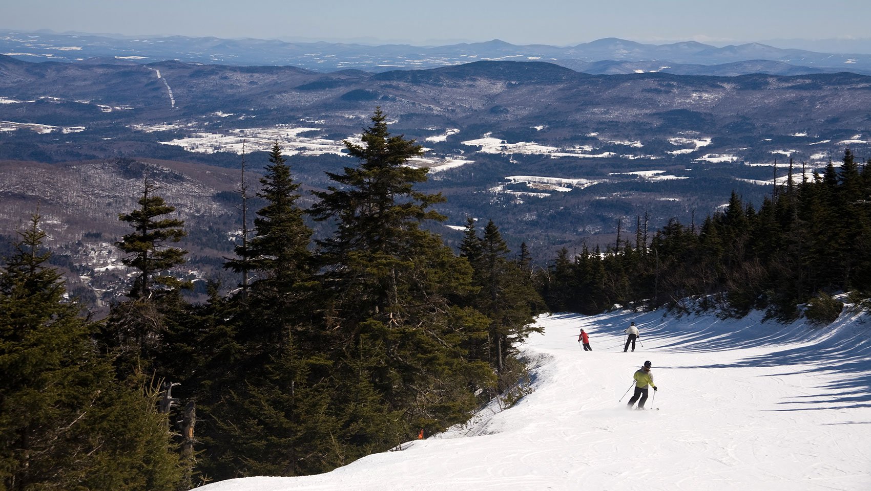 skiers on mountain slopes