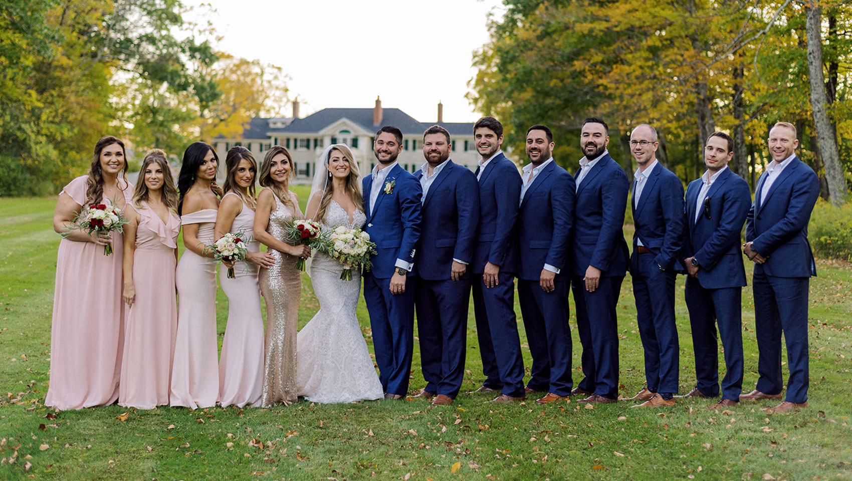 Bridal party posing in front of Kimpton Taconic Hotel