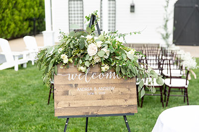 Welcome sign on wood for wedding ceremony