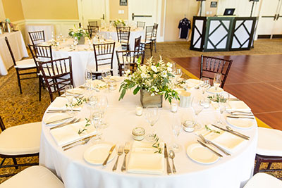 Wedding reception table set up with floral centerpieces