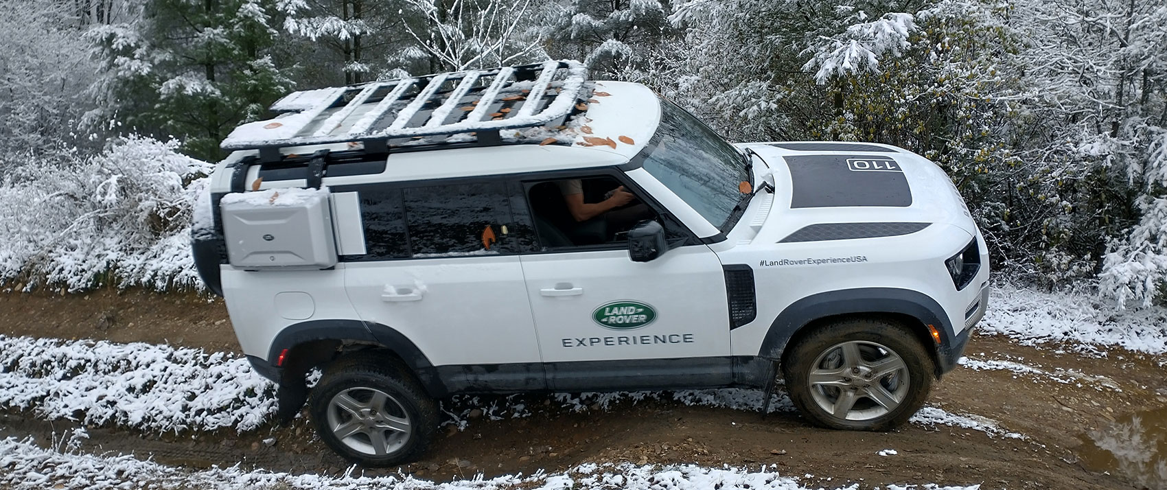 Land Rover Defender on a muddy, snowy trail